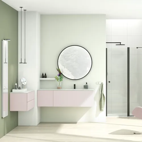 Großes und helles Badezimmer im minimalistischen Stil mit sanften Pastellfarben und eleganten grünen Nuancen, stilvollem runden Spiegel und moderner Einrichtung