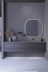 Inspiration für ein großes Badezimmer mit grauem Waschtischunterschrank mit integriertem Griff, stilvollem, seitlich montiertem Waschbecken, quadratischem Spiegel mit abgerundeten Ecken, Wänden in Betonoptik und rohen Materialien für einen urbanen Look